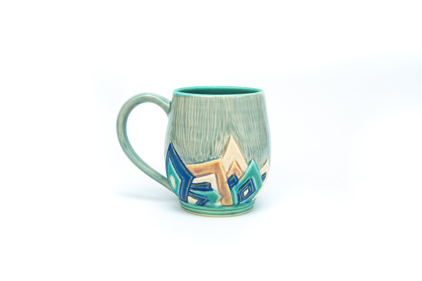 Blue Art Deco Mug with Carved overlapping angle pattern.