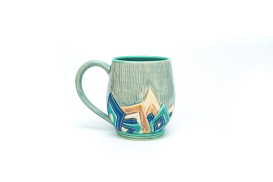Blue Art Deco Mug with Carved overlapping angle pattern.