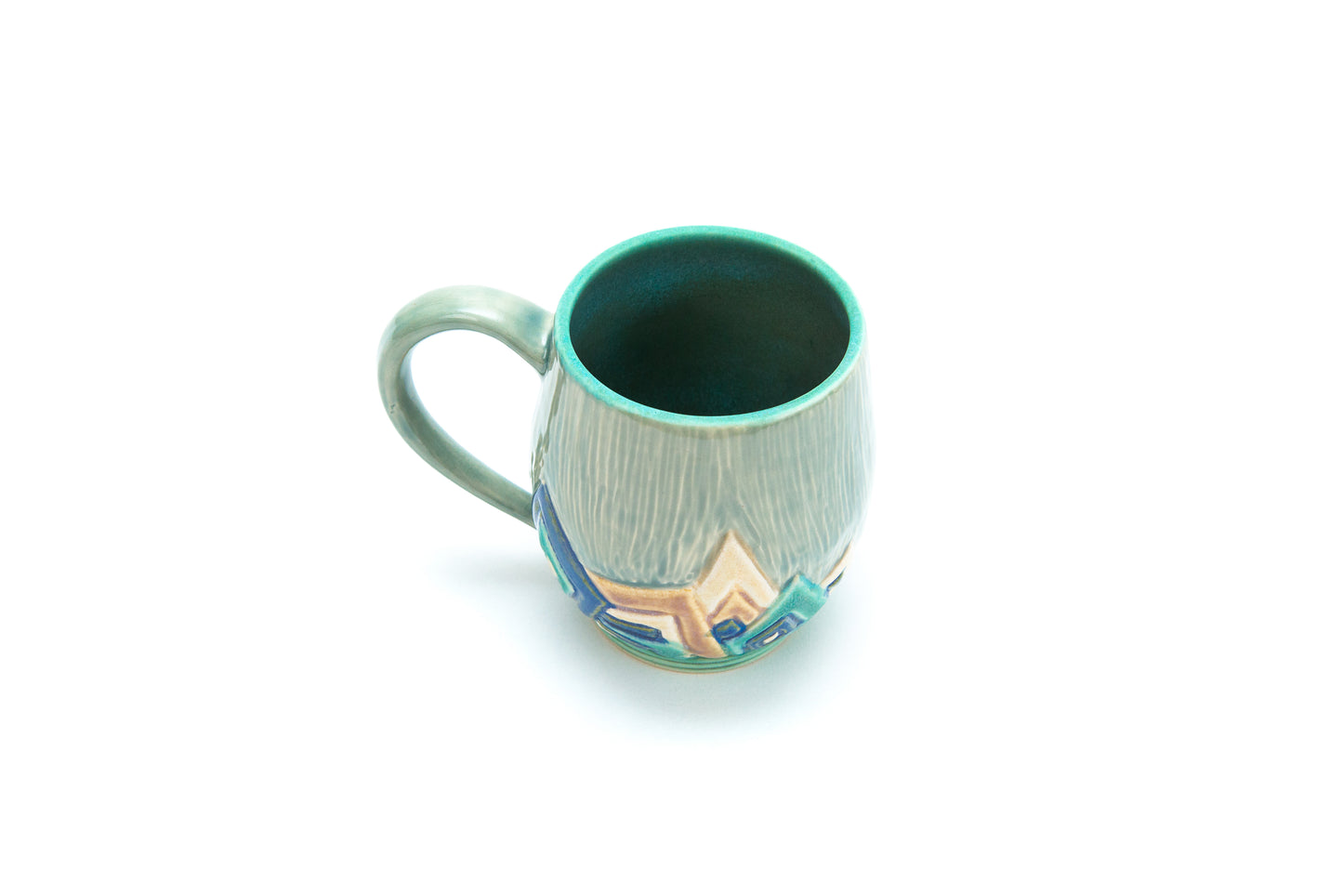 Blue Art Deco Mug with Carved overlapping angle pattern.